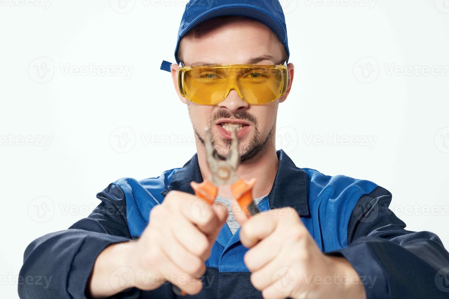 man in construction uniform pliers repair construction professionals photo