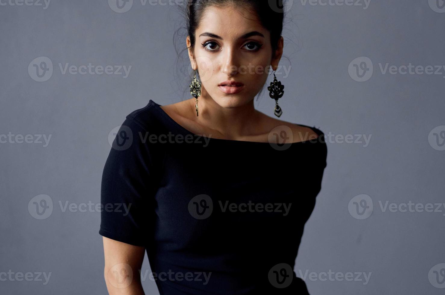 brunette earrings jewelry posing black dress isolated background photo