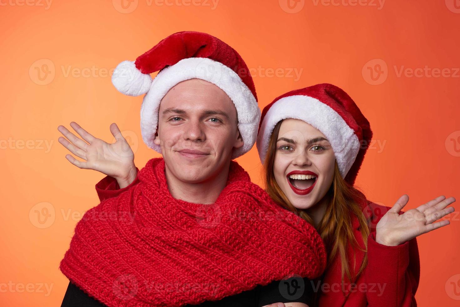 man and woman wearing christmas hats christmas holiday friendship photo