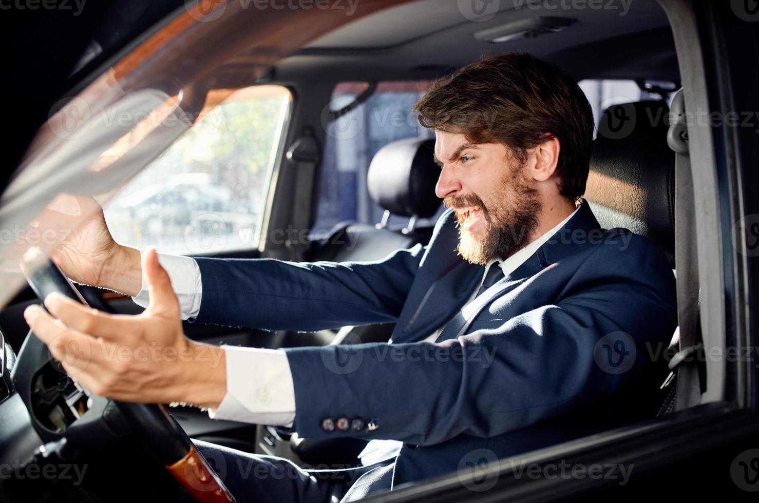 bearded man Driving a car trip luxury lifestyle rich photo