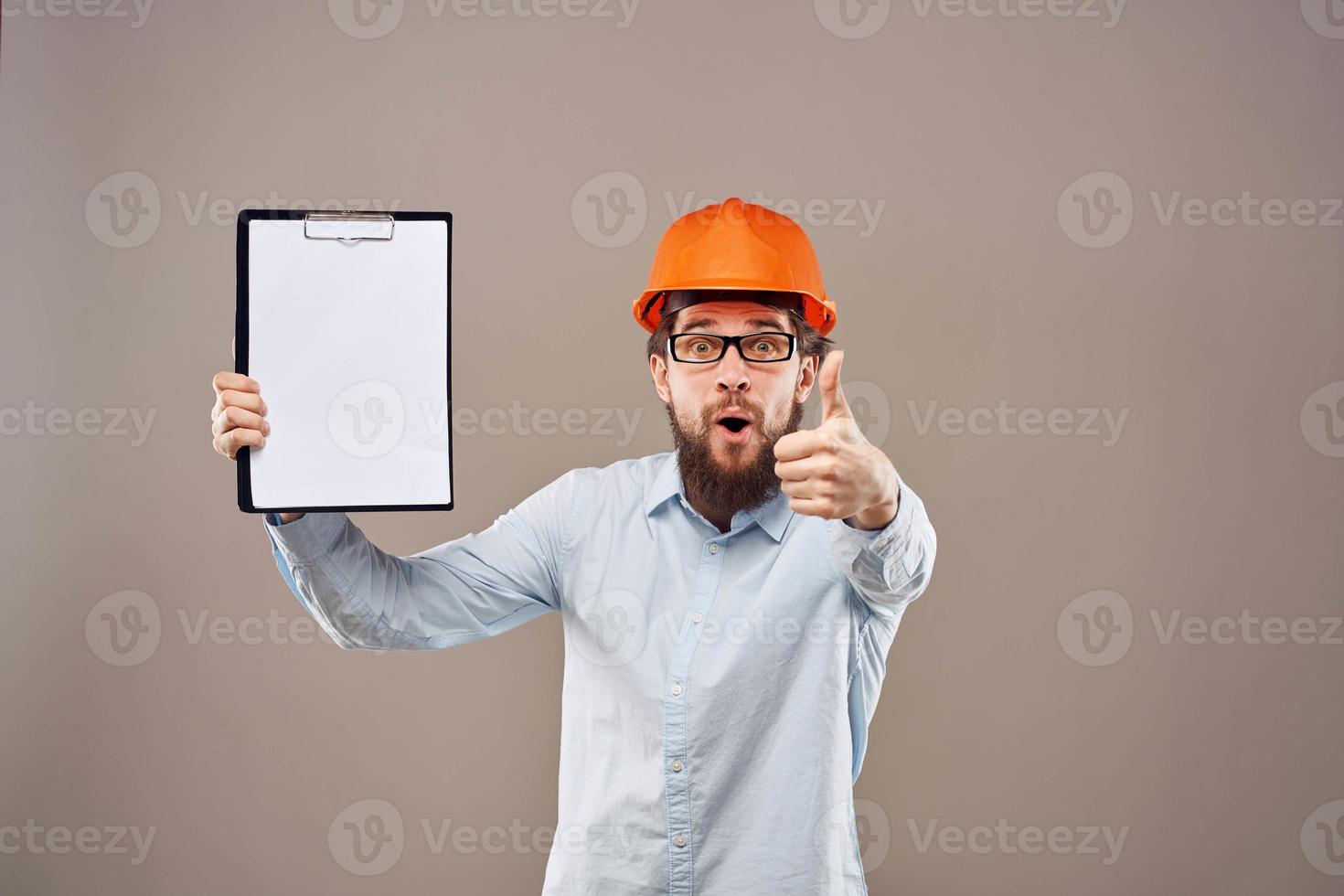 Worker man orange hard hat construction industry manual photo