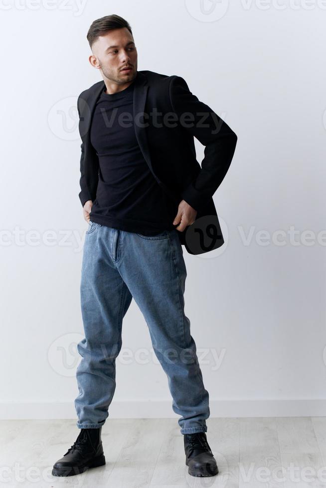 Modelling snapshots. Serious narcissistic self-confident attractive handsome man in classic suit jacket posing isolated in white studio background. Fashion offer. Copy space for ad. Full body shot photo