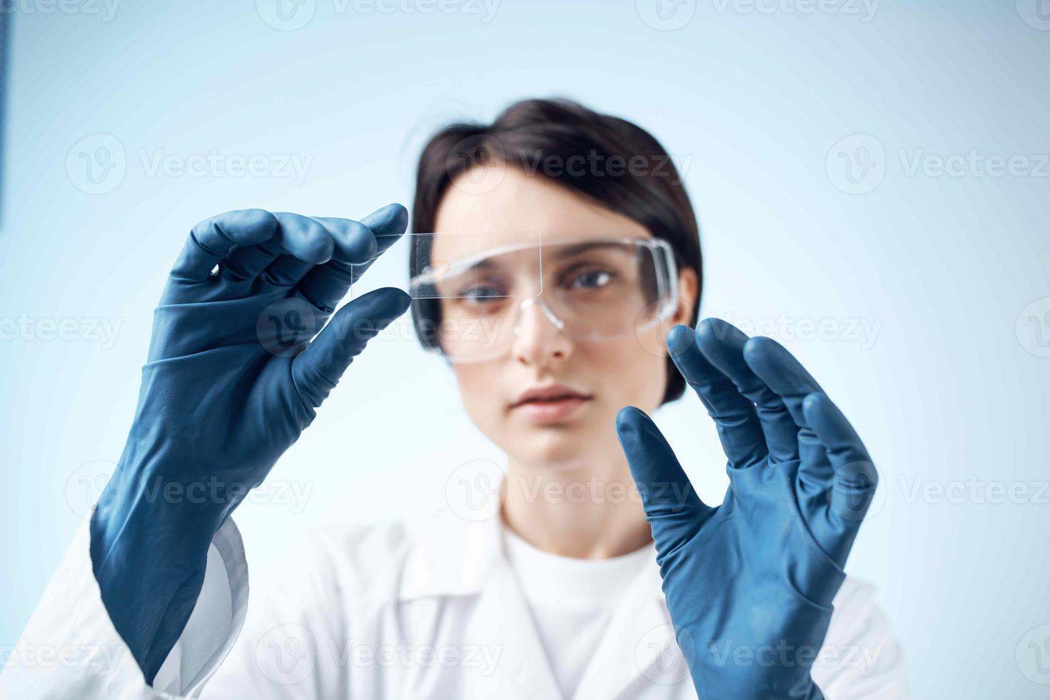 woman with blue gloves test research analysis diagnostics photo