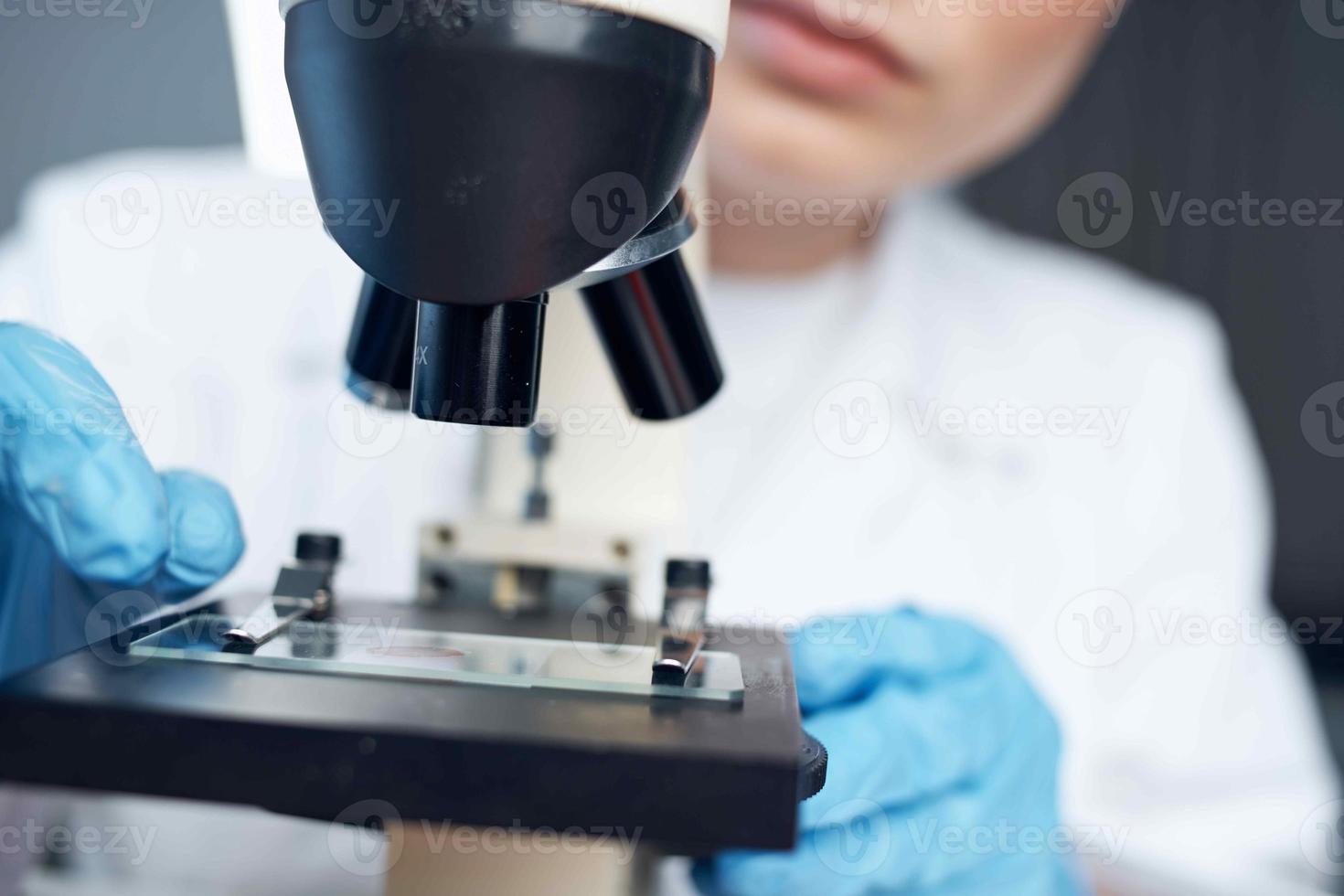 woman laboratory assistant microscope setting research microbiology photo