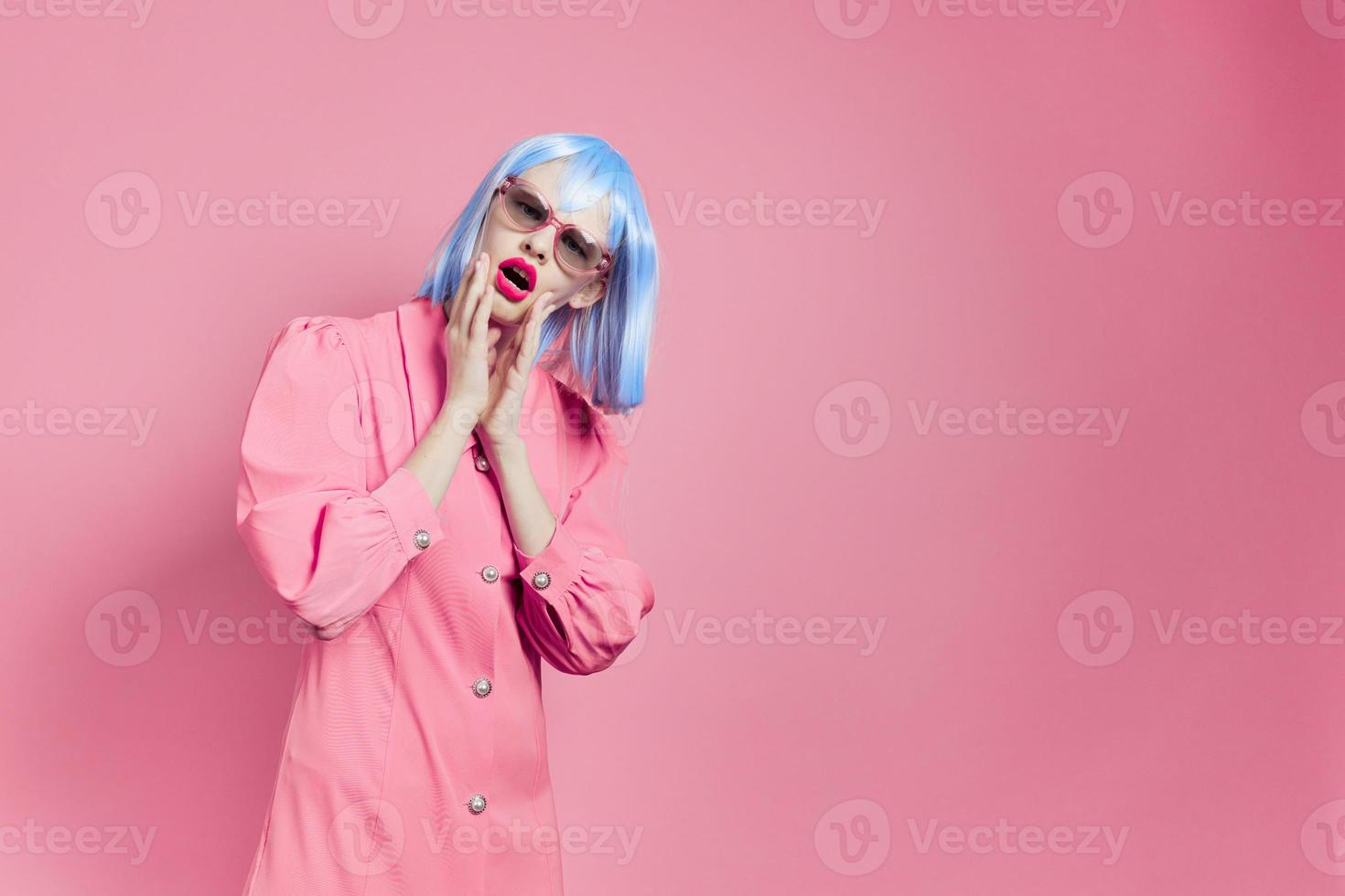 glamorous woman in blue wig pink dress red lips isolated background photo