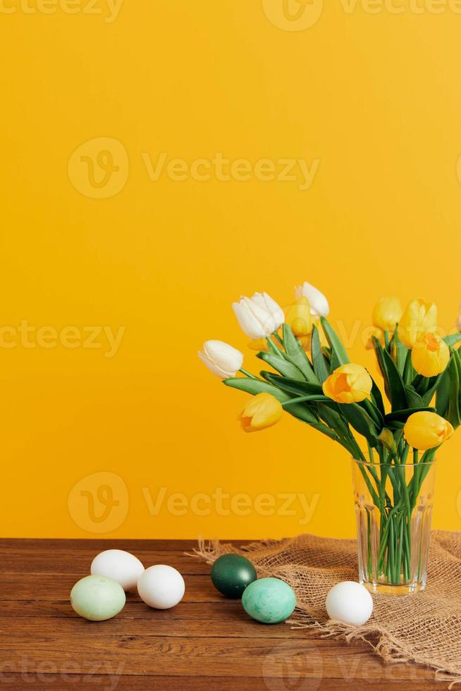 flower bouquet easter eggs spring holiday yellow background photo