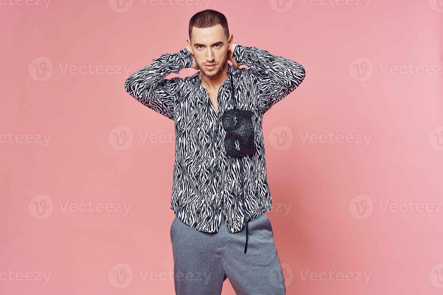 fashionable man shirt posing self confidence pink background photo