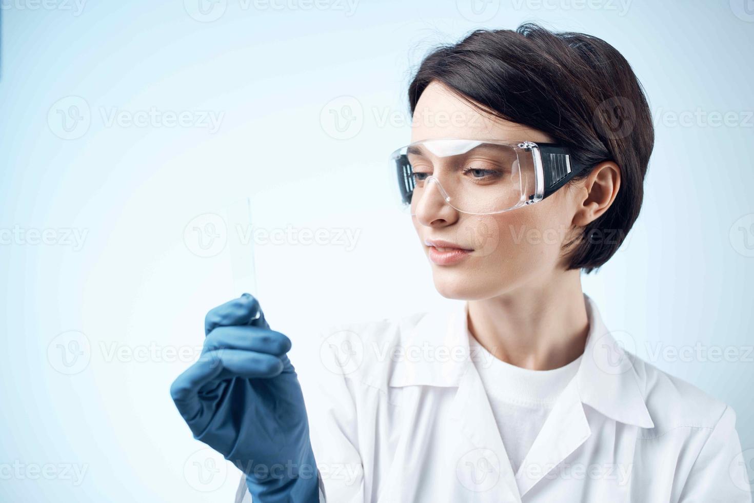 female laboratory assistant blue gloves research technology Science professional photo