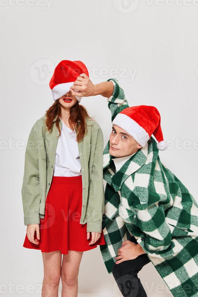 cheerful young couple hugs new year holiday friendship romance gifts photo