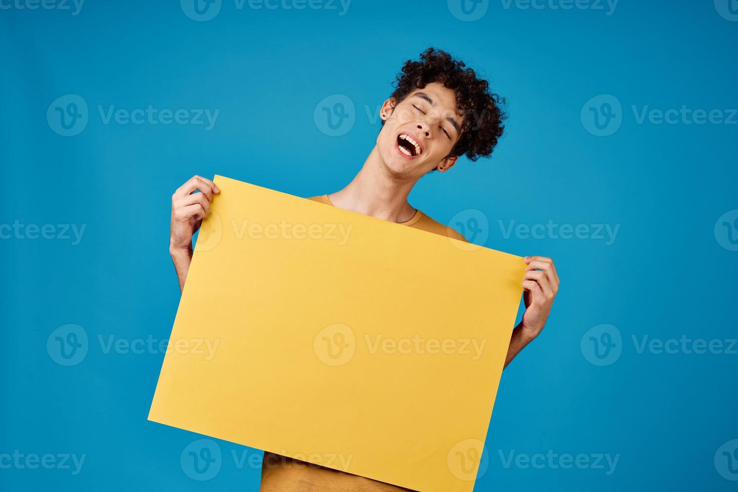 funny curly guys with a yellow sharp advertising Copy Space blue background photo