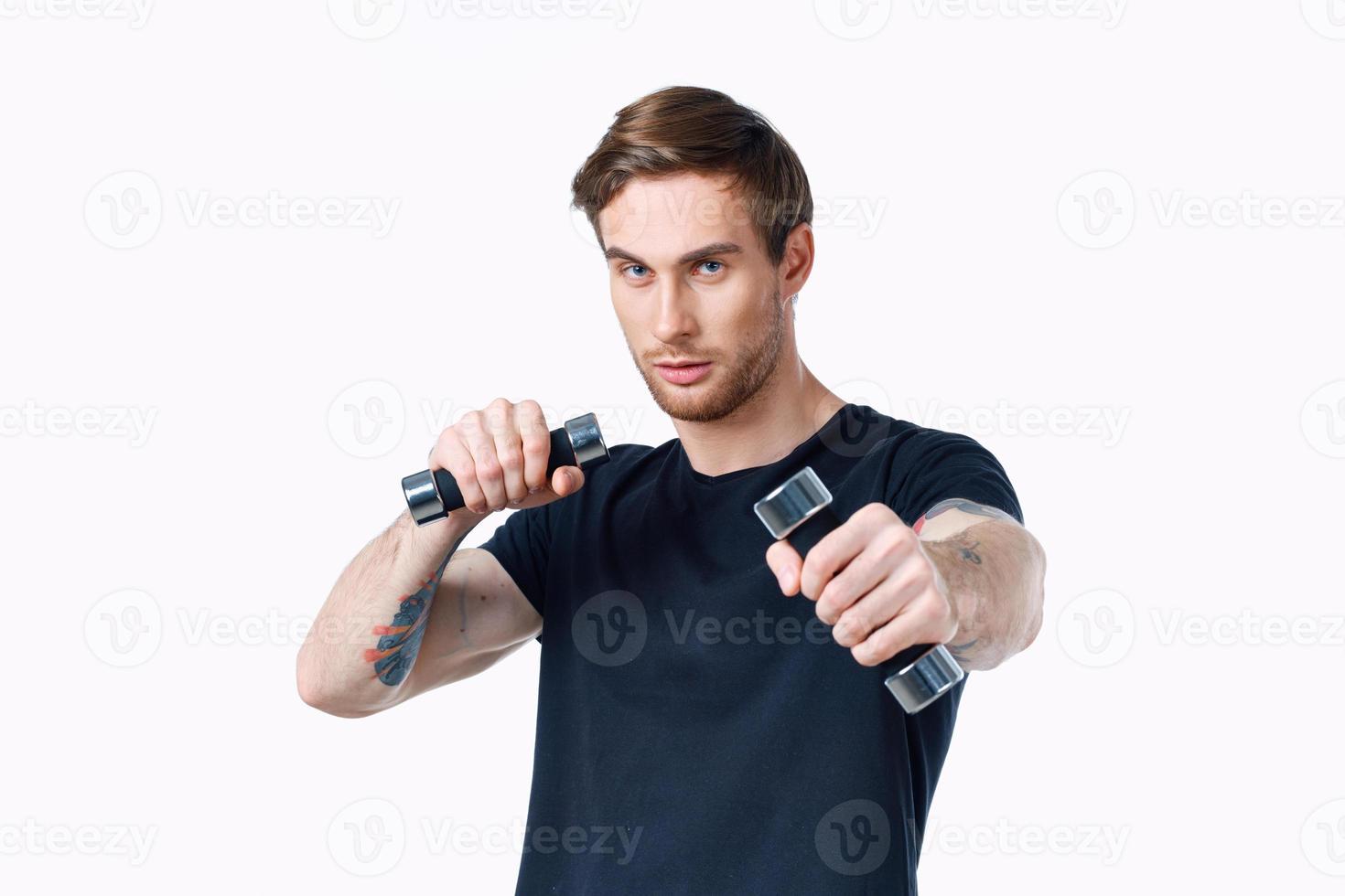 sporty young man with dumbbells on white background workout Copy Space photo