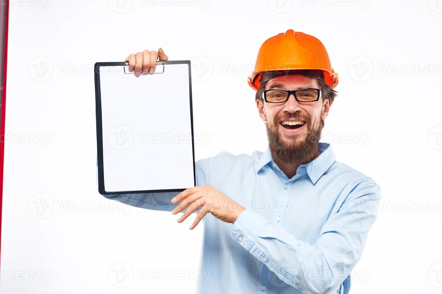 Business man construction hard hat with professional industry documents photo