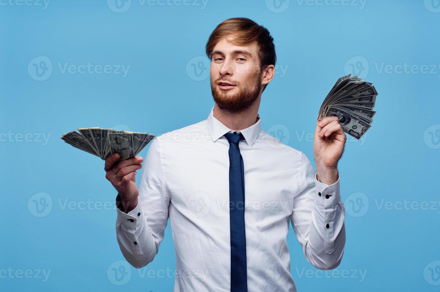 man in shirt with tie finance money self confidence blue background photo