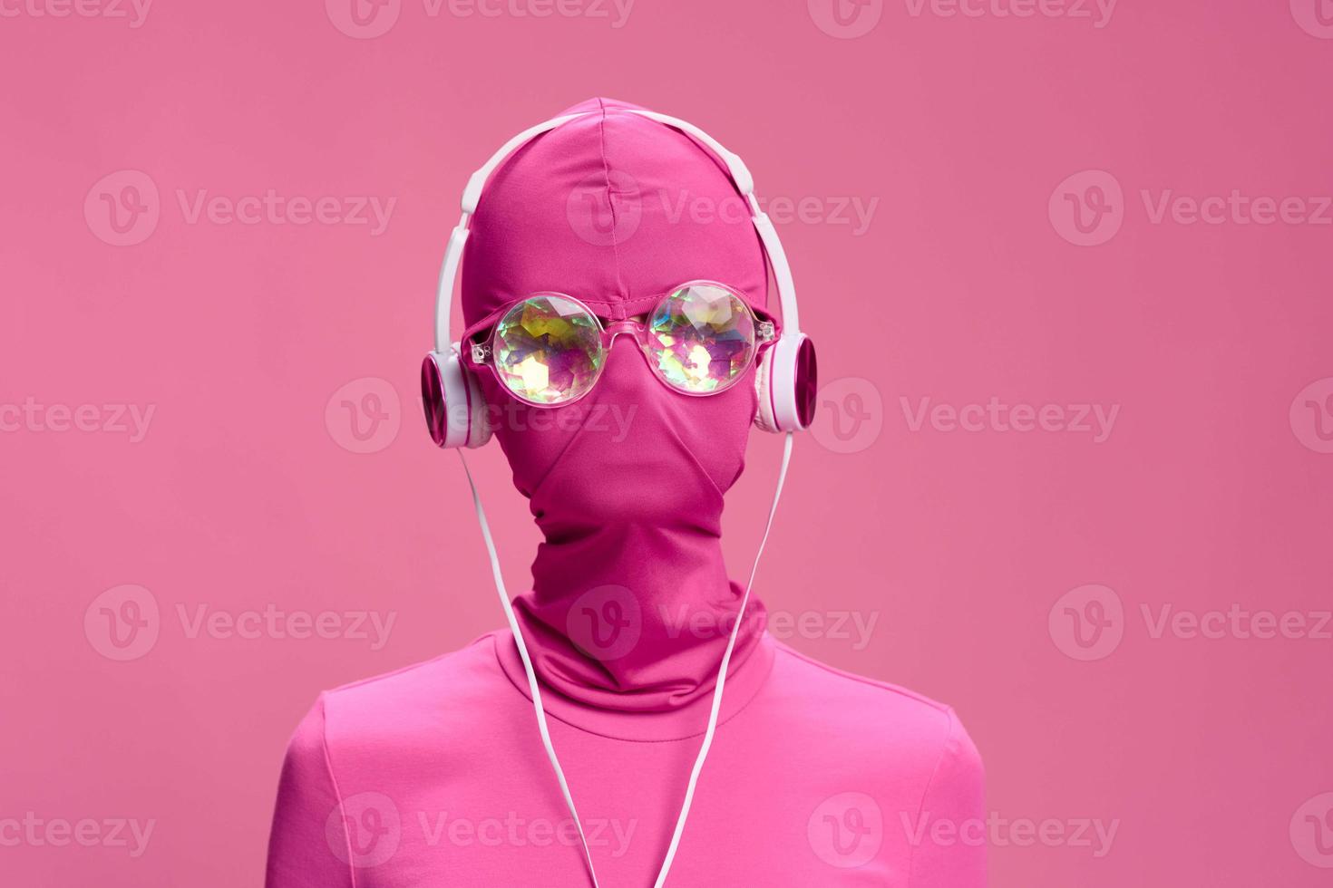 Creative crazy pink photo on a pink background with pink clothes and accessories, cyberpunk concept and conceptual art photography