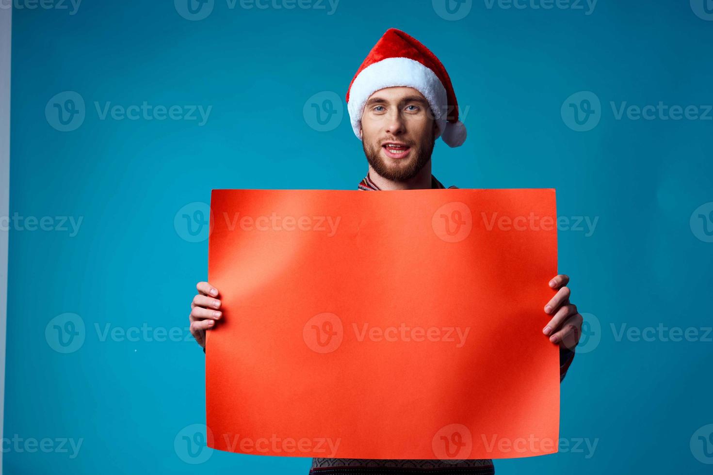 emotional man in a christmas Orange mockup Poster blue background photo