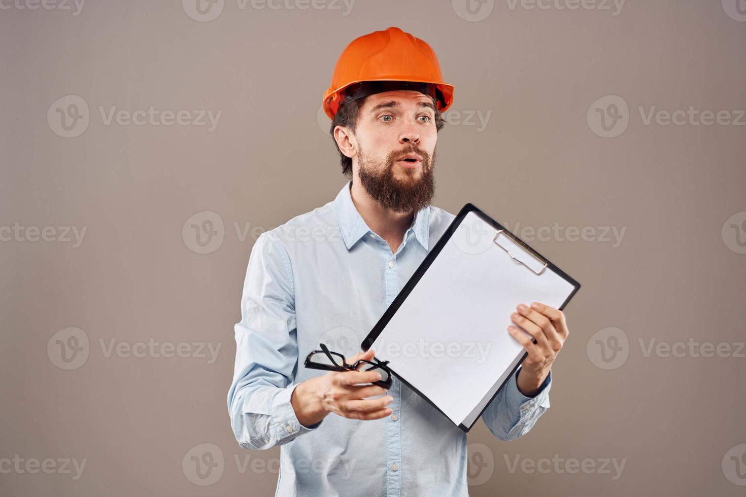Cheerful male engineer orange hard hat professional construction work photo