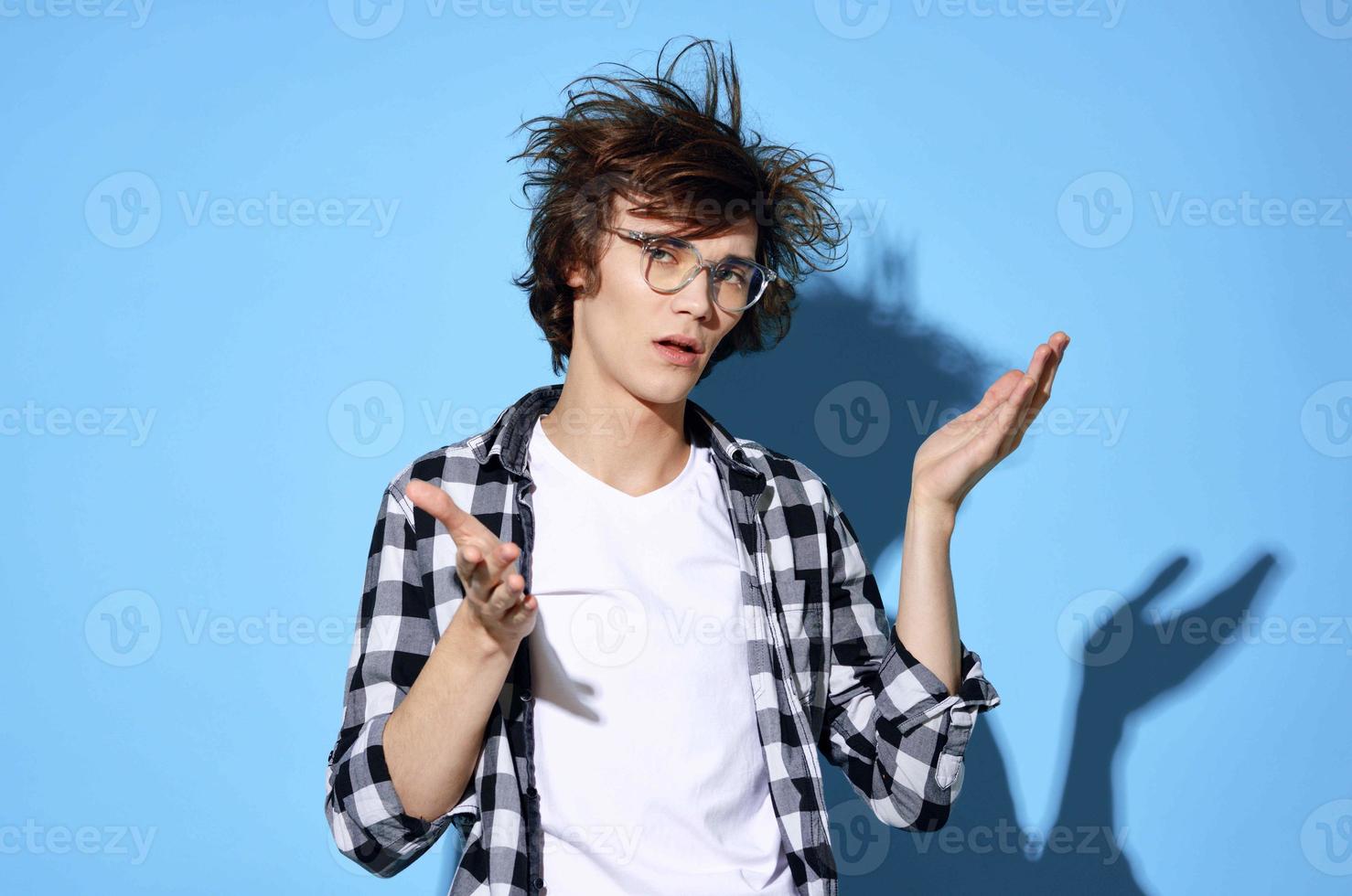 guy in plaid shirt tousled hair glasses fashion posing photo