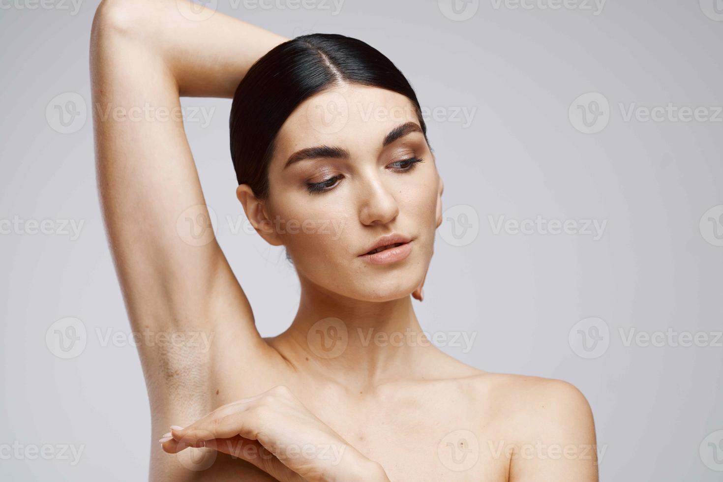 brunette bare shoulders clear skin depilation care photo