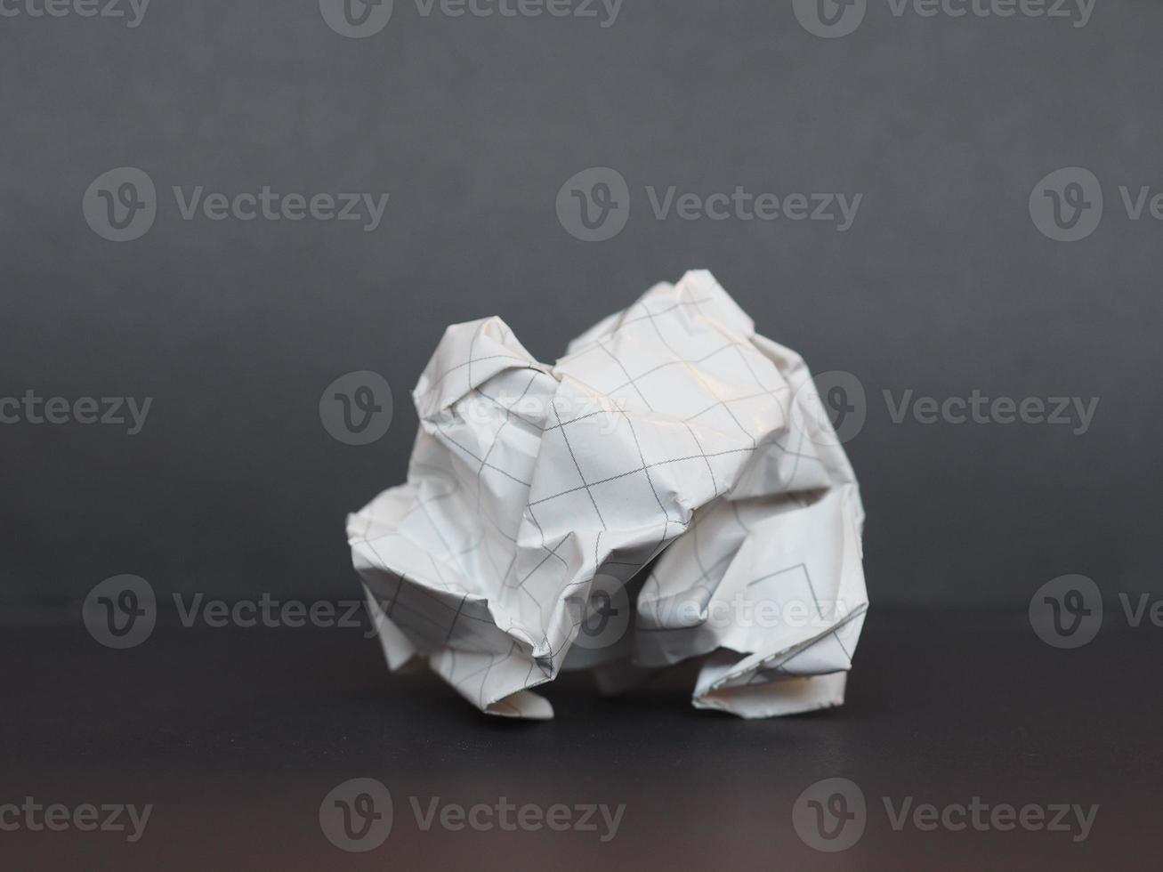 white paper ball over dark gray background photo