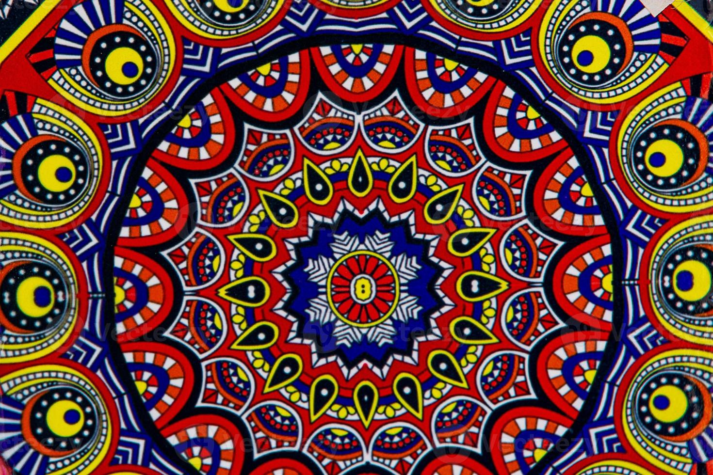 ceramic tiles souvenirs in a shop in the south of spain in a tourist town, colorful art crafts background photo