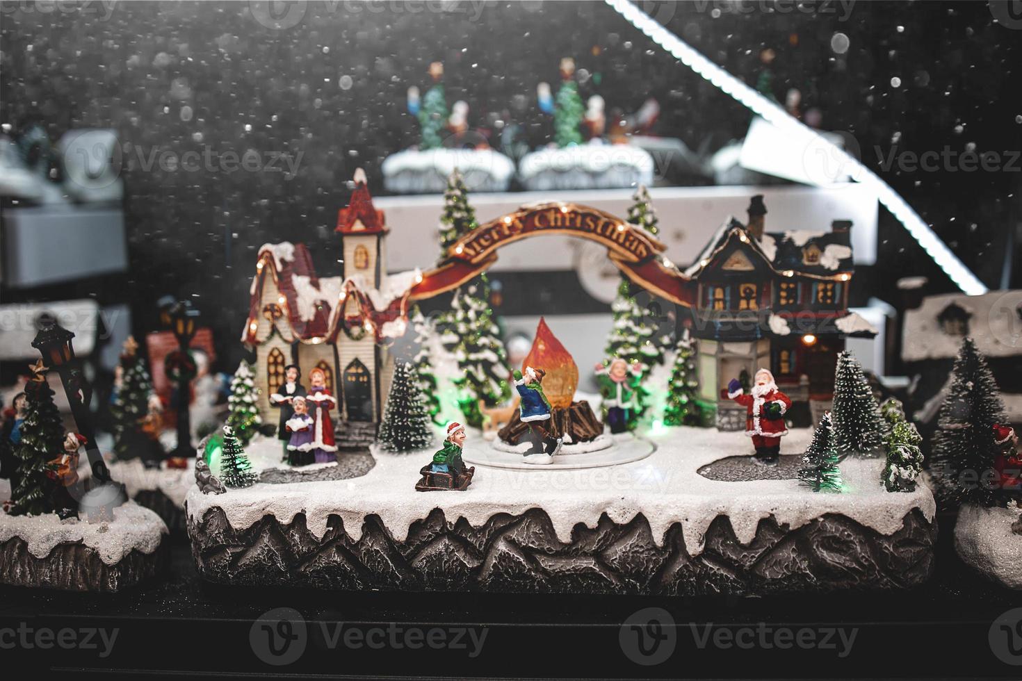 Christmas decorations with moving figurines on a winter background photo