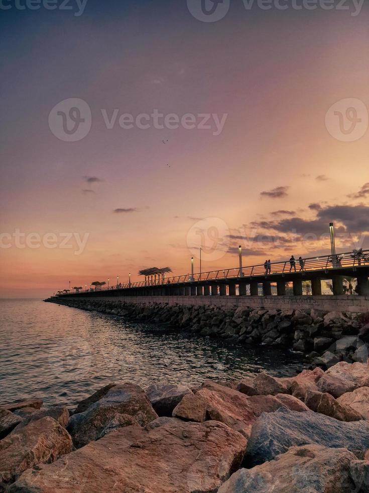 l sunset landscape of alicante spain with pier photo