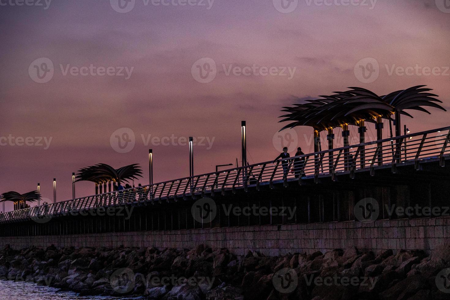 l sunset landscape of alicante spain with pier photo