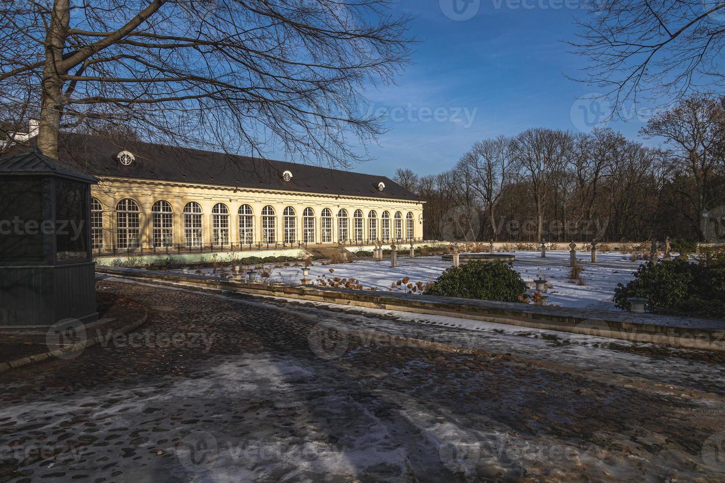 landscape with historic building in early spring sunny day in city park Warsaw Poland photo