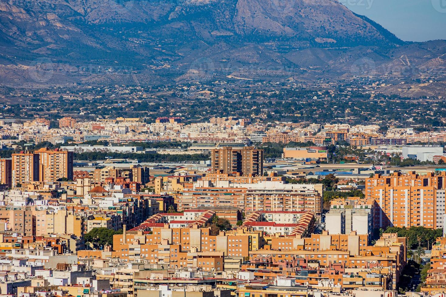 view on a sunny day of the city and colorful buildings from the viewpoint Alicante Spain photo