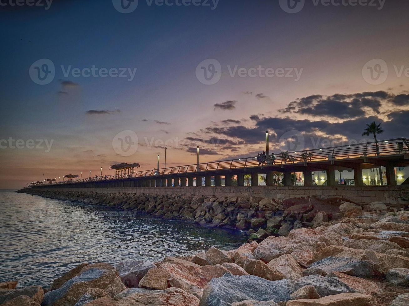 l sunset landscape of alicante spain with pier photo
