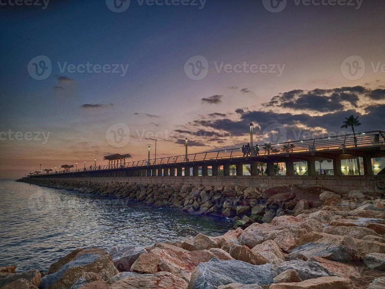 l sunset landscape of alicante spain with pier photo