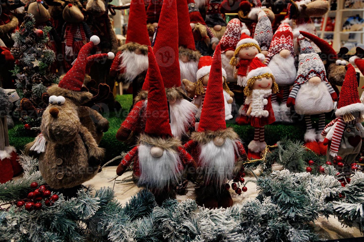 plush christmas elves in red hats background photo