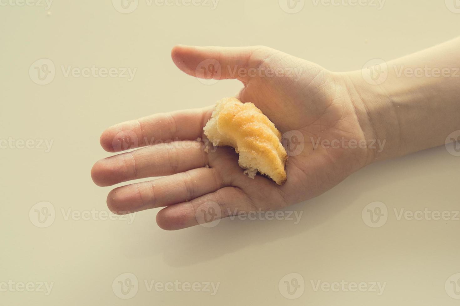 tasty  little Easter cupcake on a child's hand on a light background photo