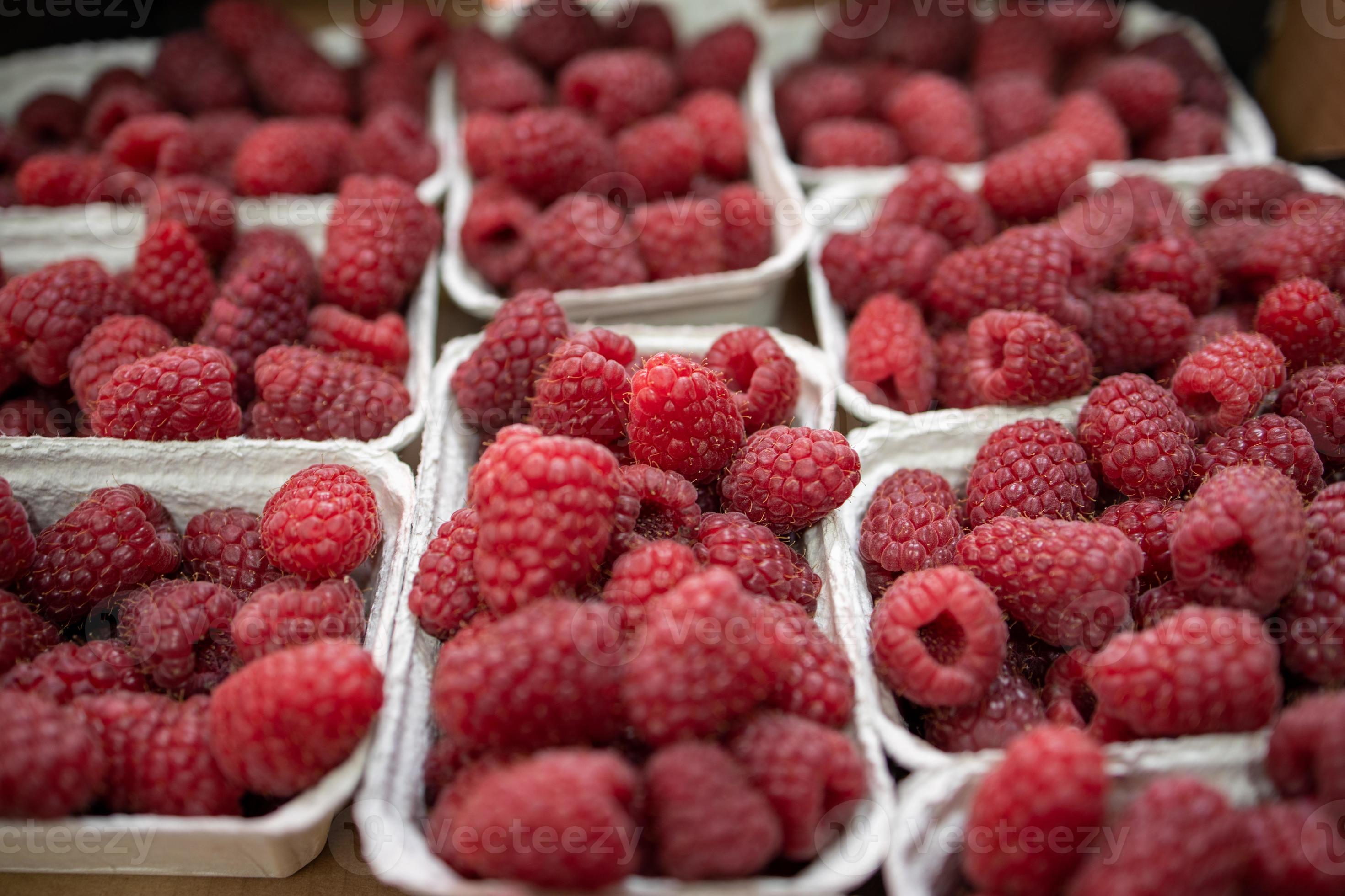 raspberries in containers on a stall forming a background 22265037
