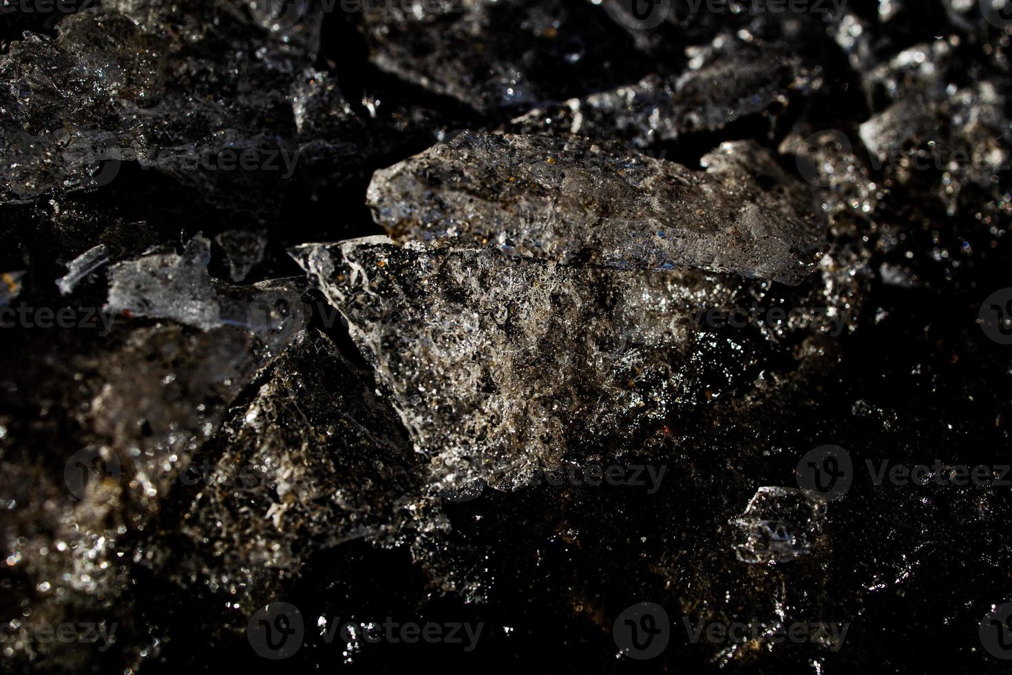 nteresting abstract background with ice close-up on a frozen puddle photo