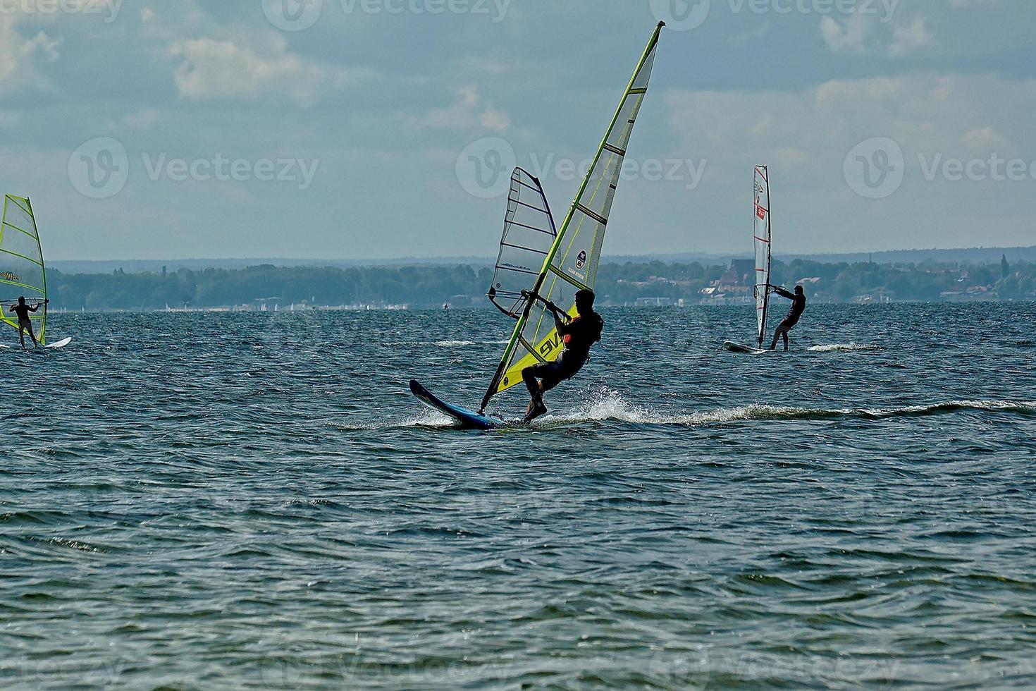 windsurfing on the bay of pucka on the baltic sea photo