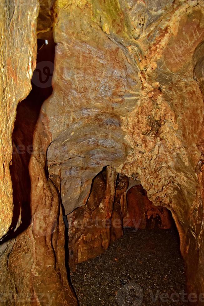 interesting original cave in the Turkish mountains with stalactites and stalagmites creating the background photo
