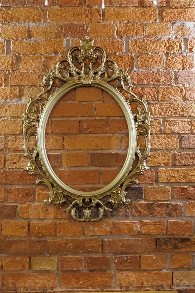 golden retro frame on brick red wall background photo