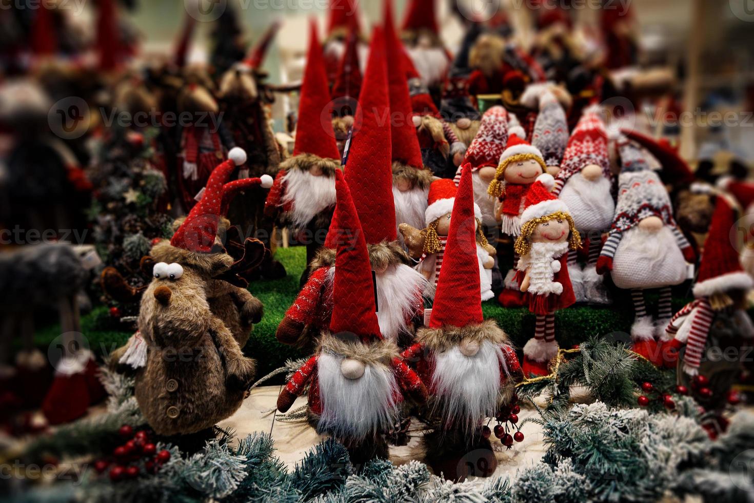 plush christmas elves in red hats background photo