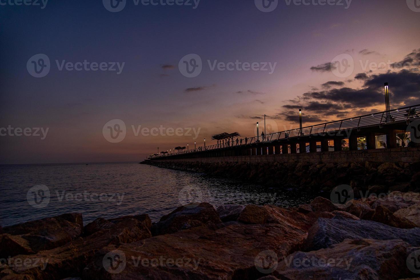 l sunset landscape of alicante spain with pier photo