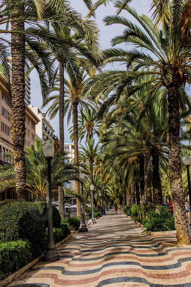 famous original seaside arcade in alicante spain on a warm summer day photo