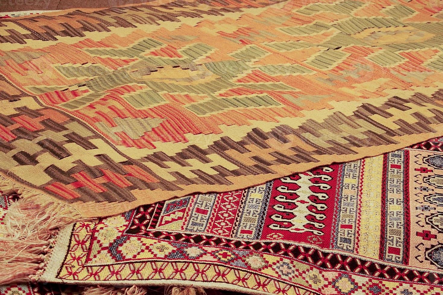 interesting background with handmade Turkish rugs in close-up photo