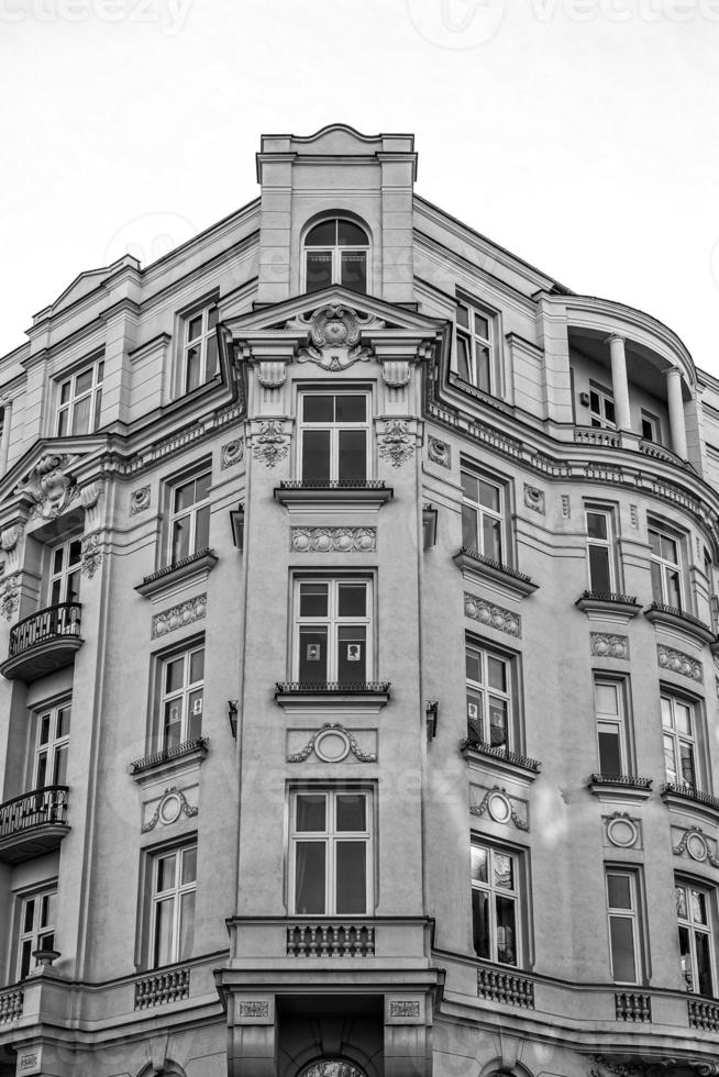 old historic tenement house in Warsaw downtown with the symbol of women's protests in the window photo