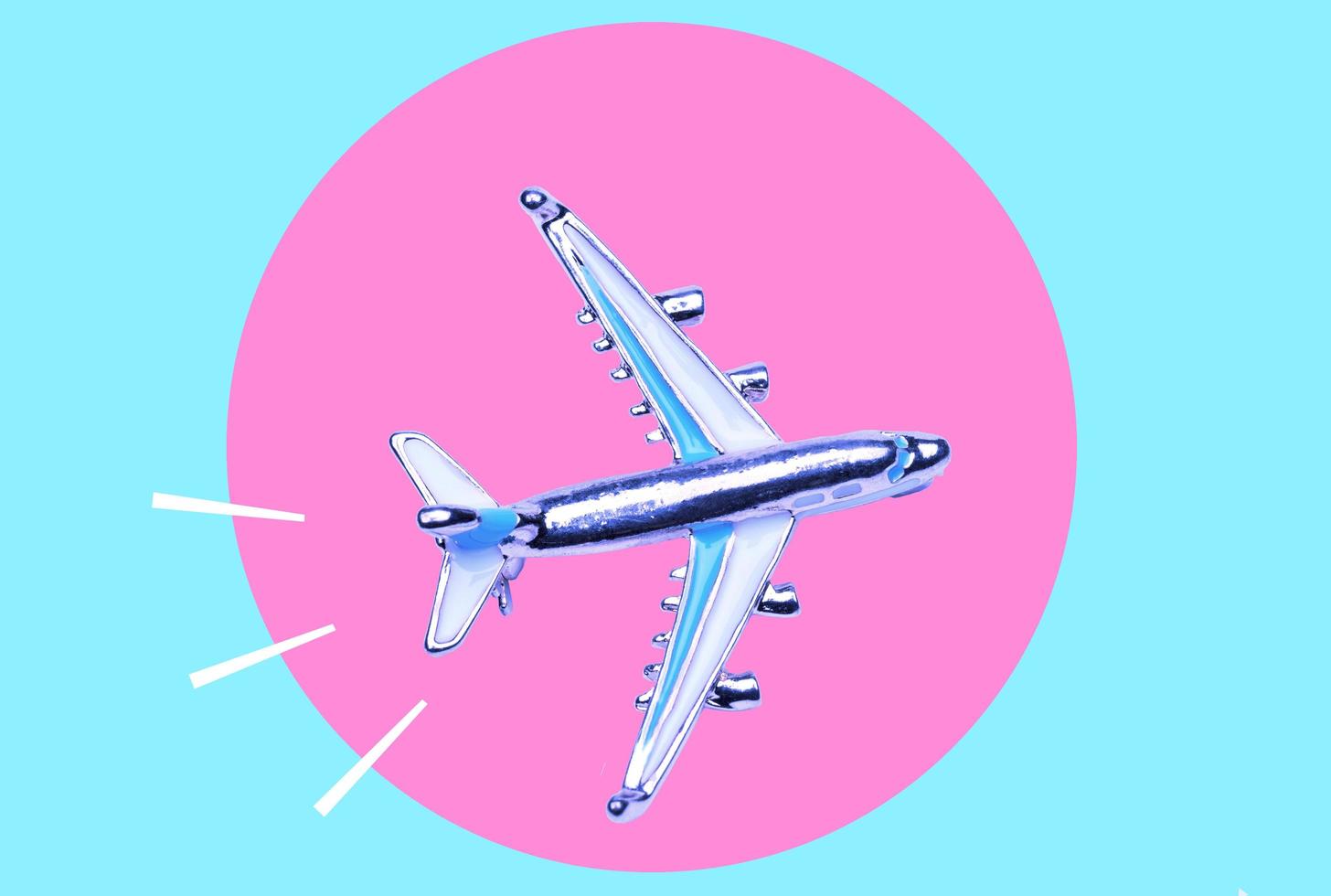Arte collage, un avión en neón colores y en un neón círculo. foto