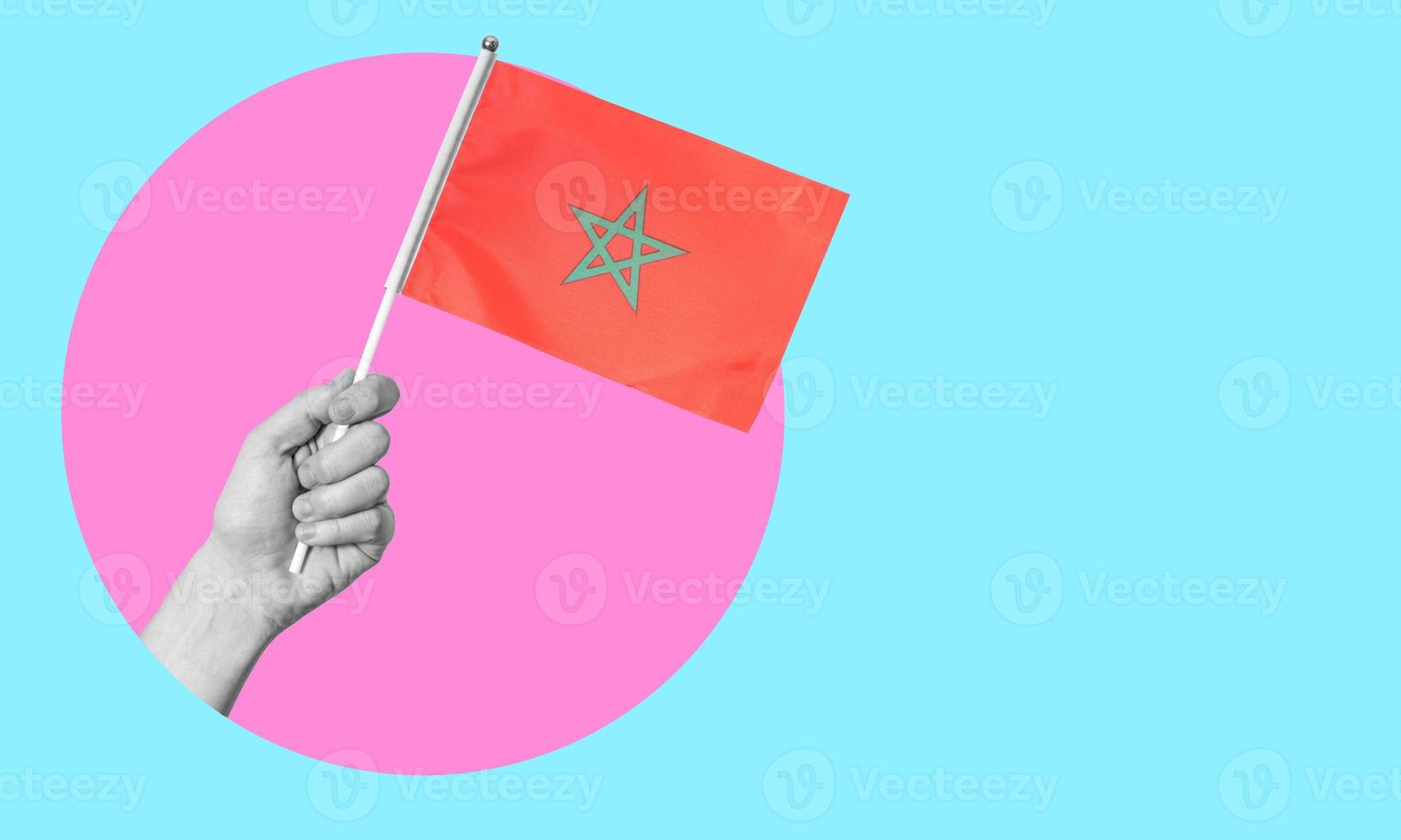 A collage of modern art. Female hand holding a Moroccan flag in a circle, neon background, with space for text. photo