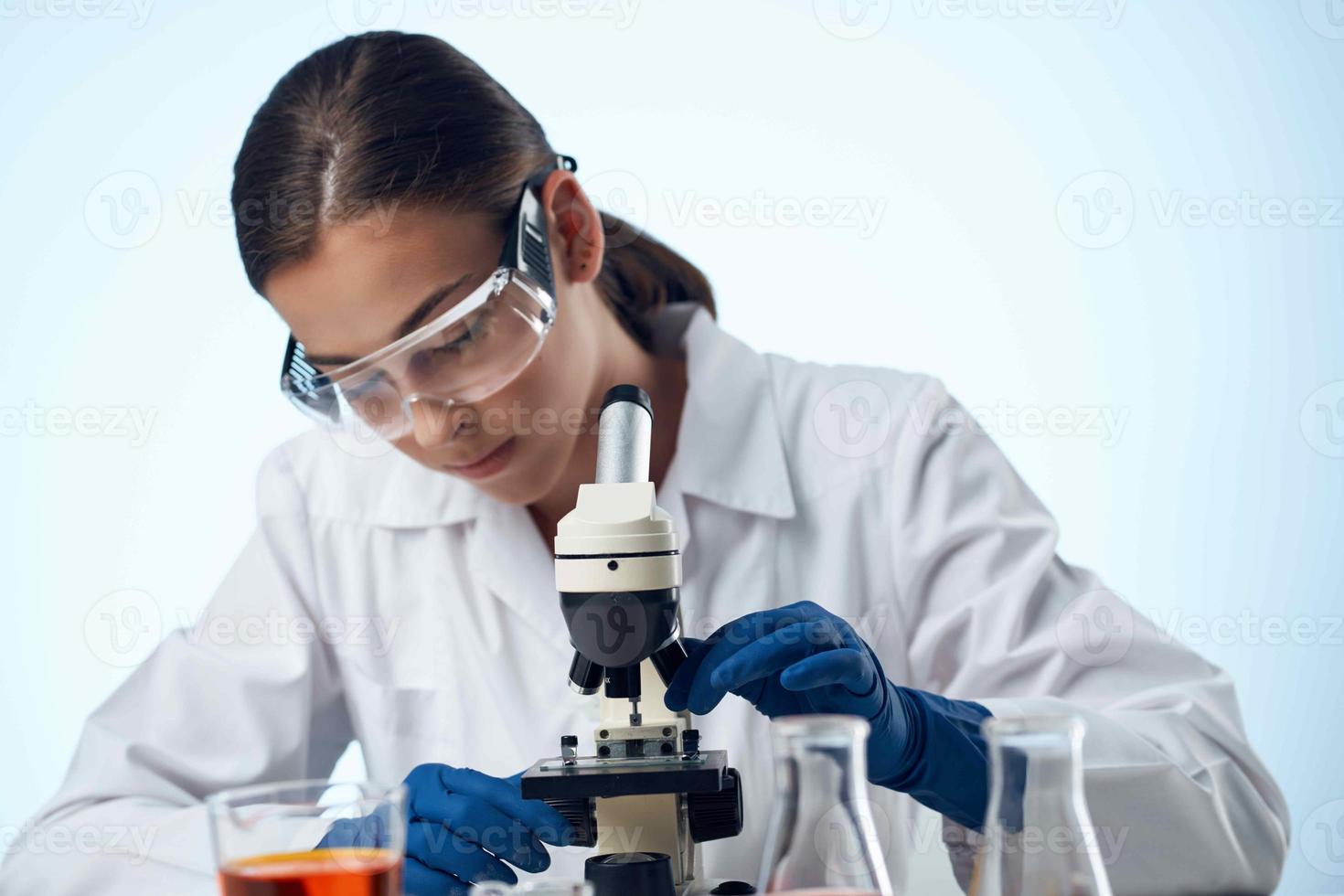 woman doctor laboratory microscope research close-up photo