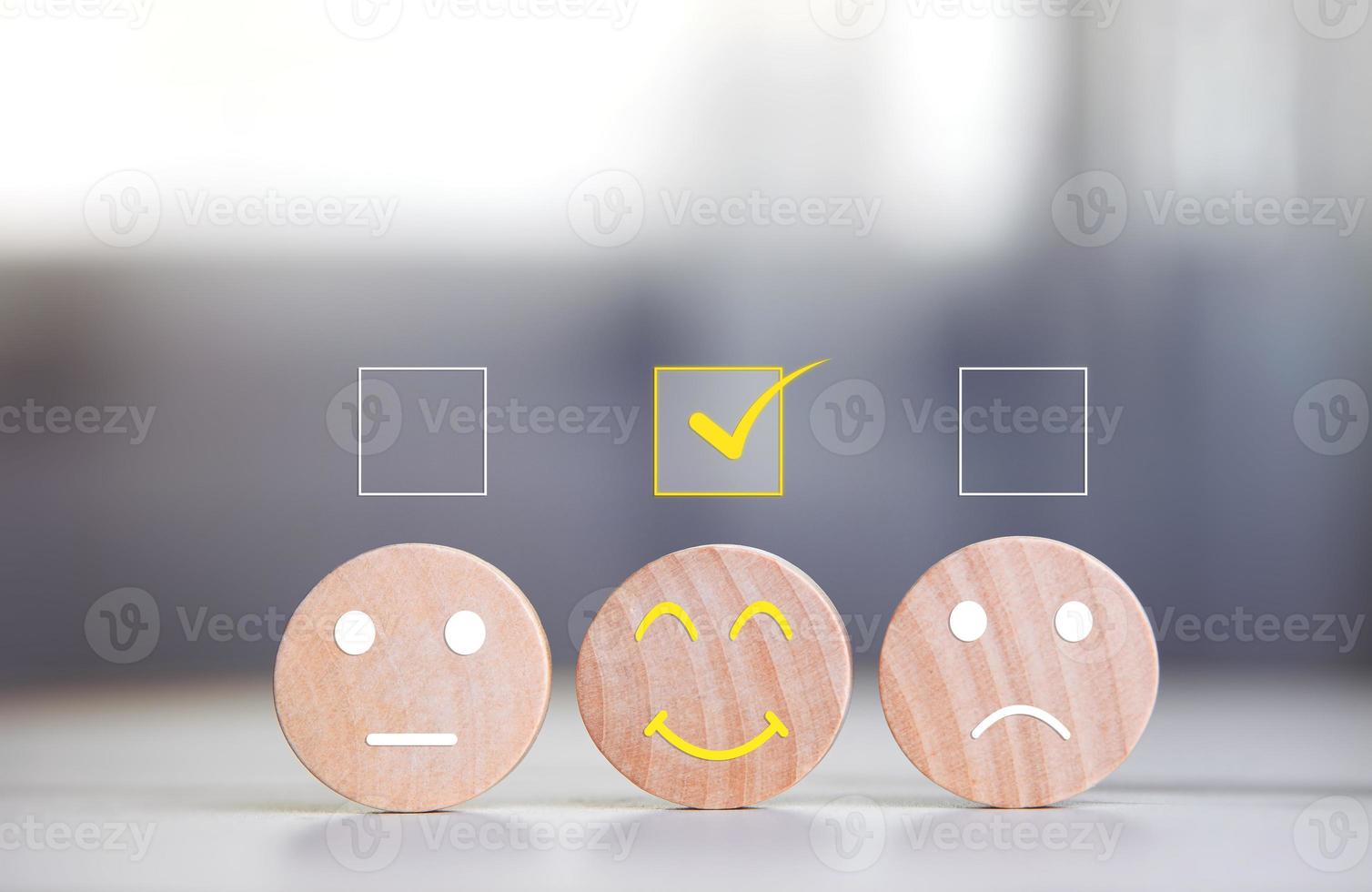 Various emotional expressions on a round wooden board with a check mark on table. Concept of satisfaction survey, mental health rating scale by best rating photo