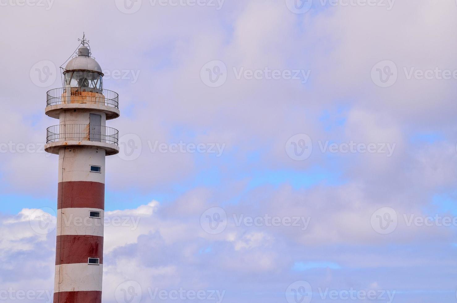 Lighthouse by the sea photo