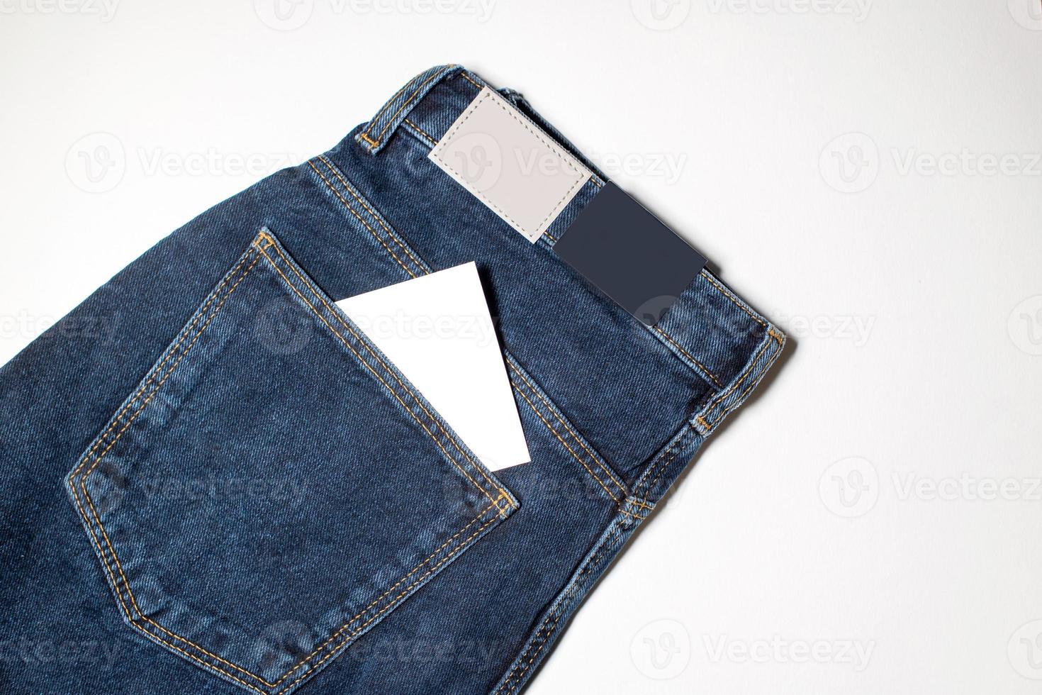 An empty note in the pocket of jeans photo