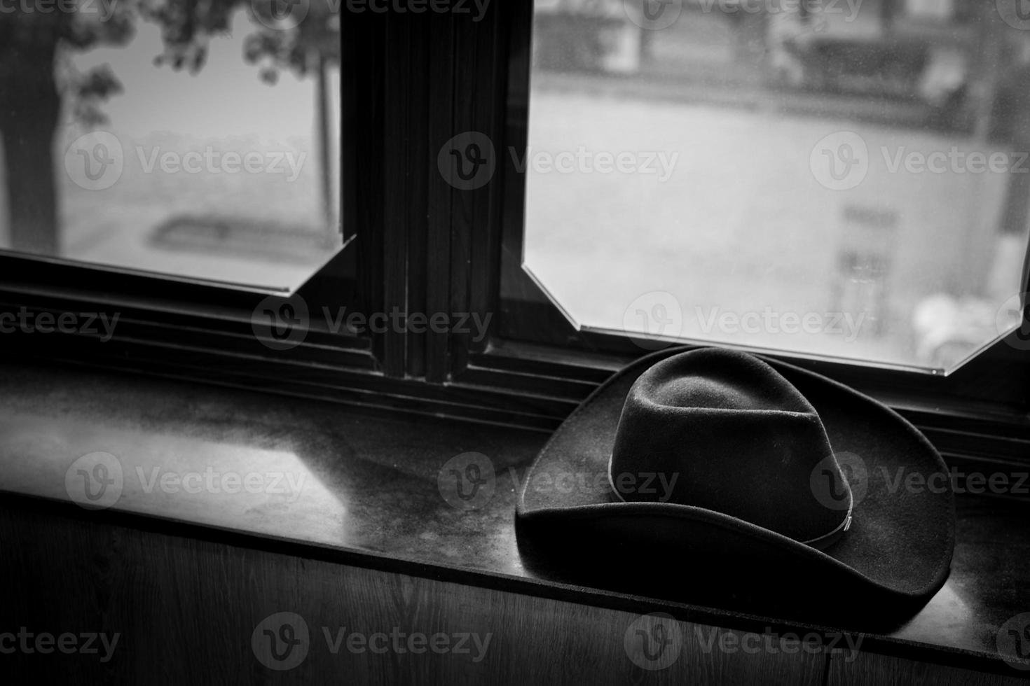 cowboy hat on windowsill photo